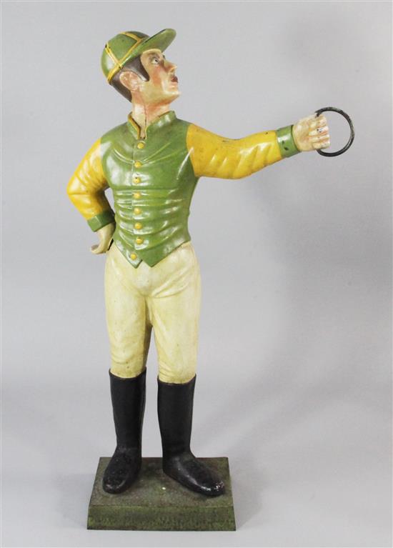 A 20th century polychrome painted cast iron lawn jockey, 4ft 2in.